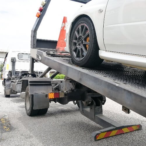 Vehicle being loaded onto transport equipment